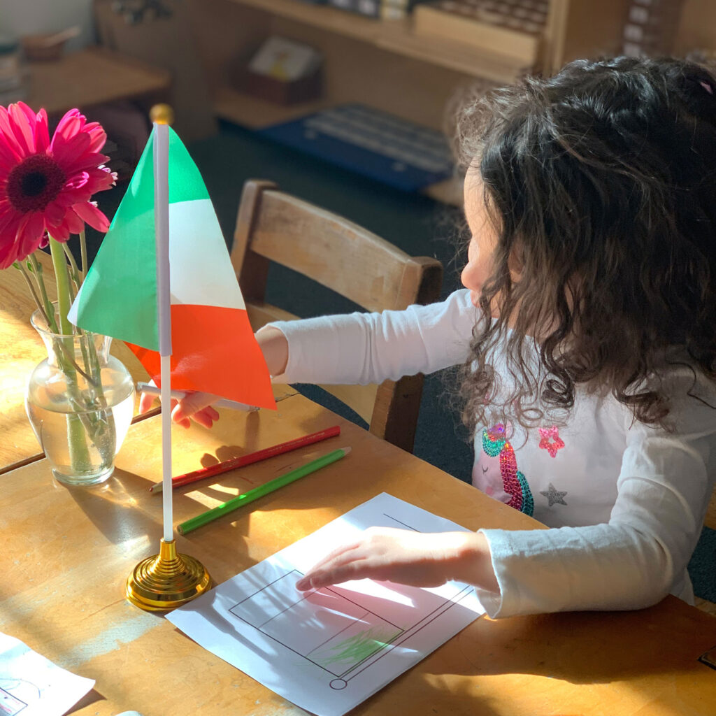 Students draw and name the flags of various countries.