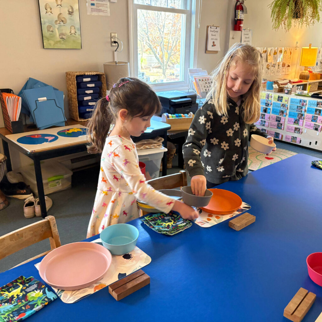 Kindergarten students setting the table for lunch
